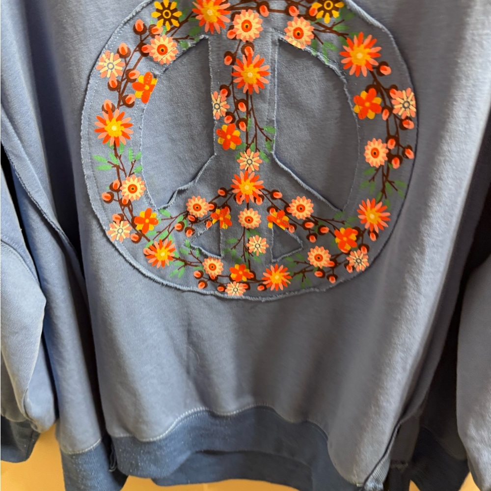 Easel Blue Top with Vibrant Floral Peace Sign Design